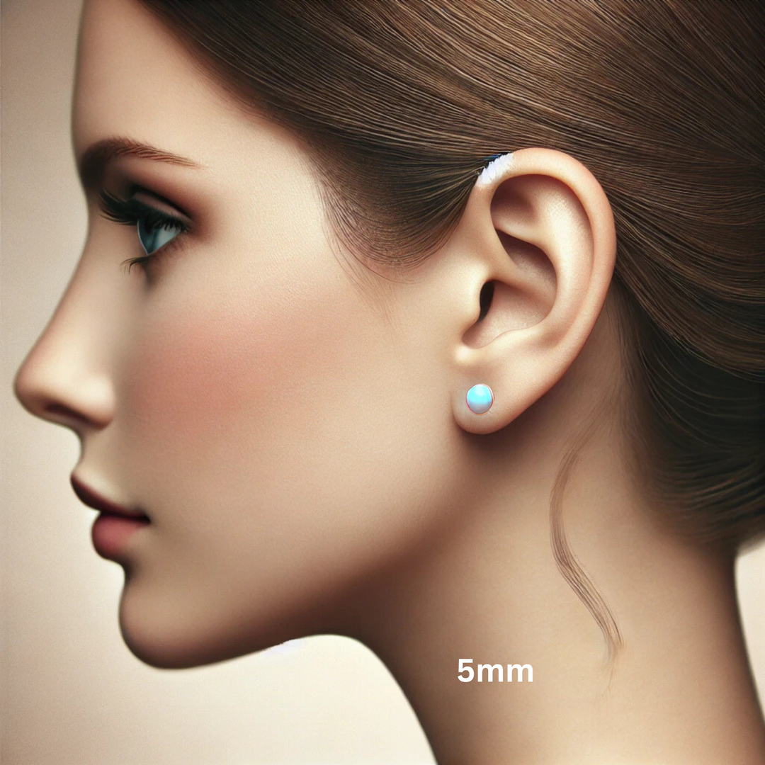 5mm Opal Earrings on the Ear, Classic bezel settings in 14K Gold