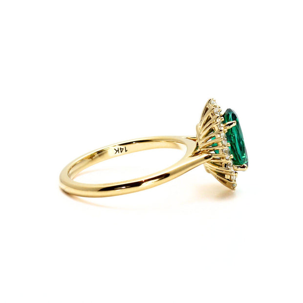 14K lab created emerald ring diamond accents in yellow gold.