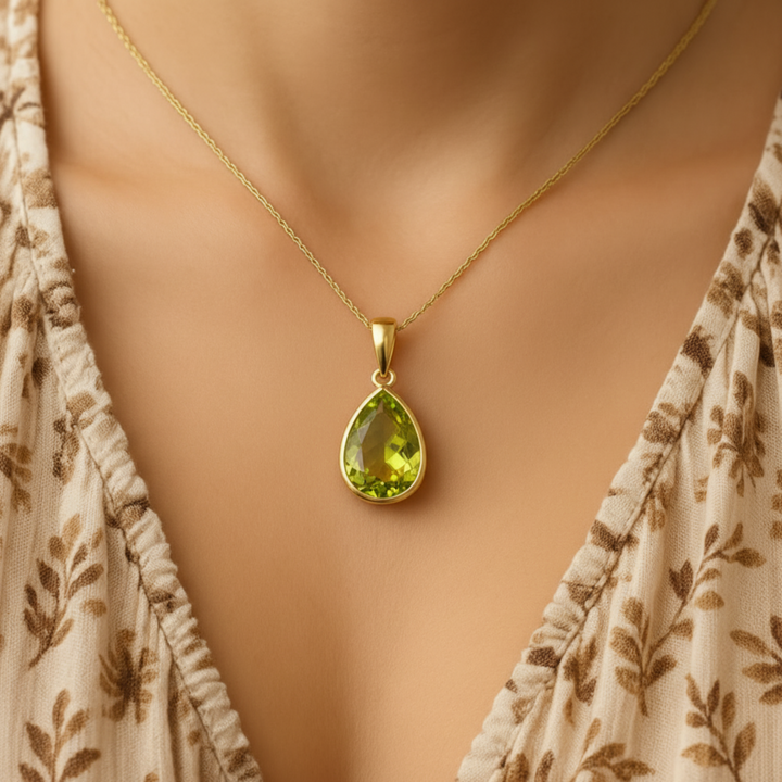 14K Peridot Pendant Shown on Model, Pear Shaped August Birthstone Necklace in Modern Bezel Set Minimalist Design | Rare Earth Jewelry