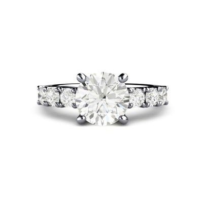 A 2 carat round moissanite solitaire engagement ring with Charles & Colvard Forever One Moissanite in a classic 4 prong design with accents on the shank.