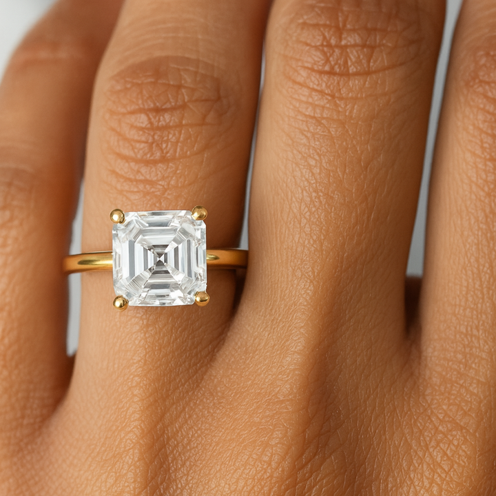 An 8mm Asscher Cut Solitaire Ring shown on the Finger, Close up of 3 Carat Asscher Diamond Ring on the Hand, Ethical Lab Grown Diamond Alternative Engagement Rings from Rare Earth Jewelry