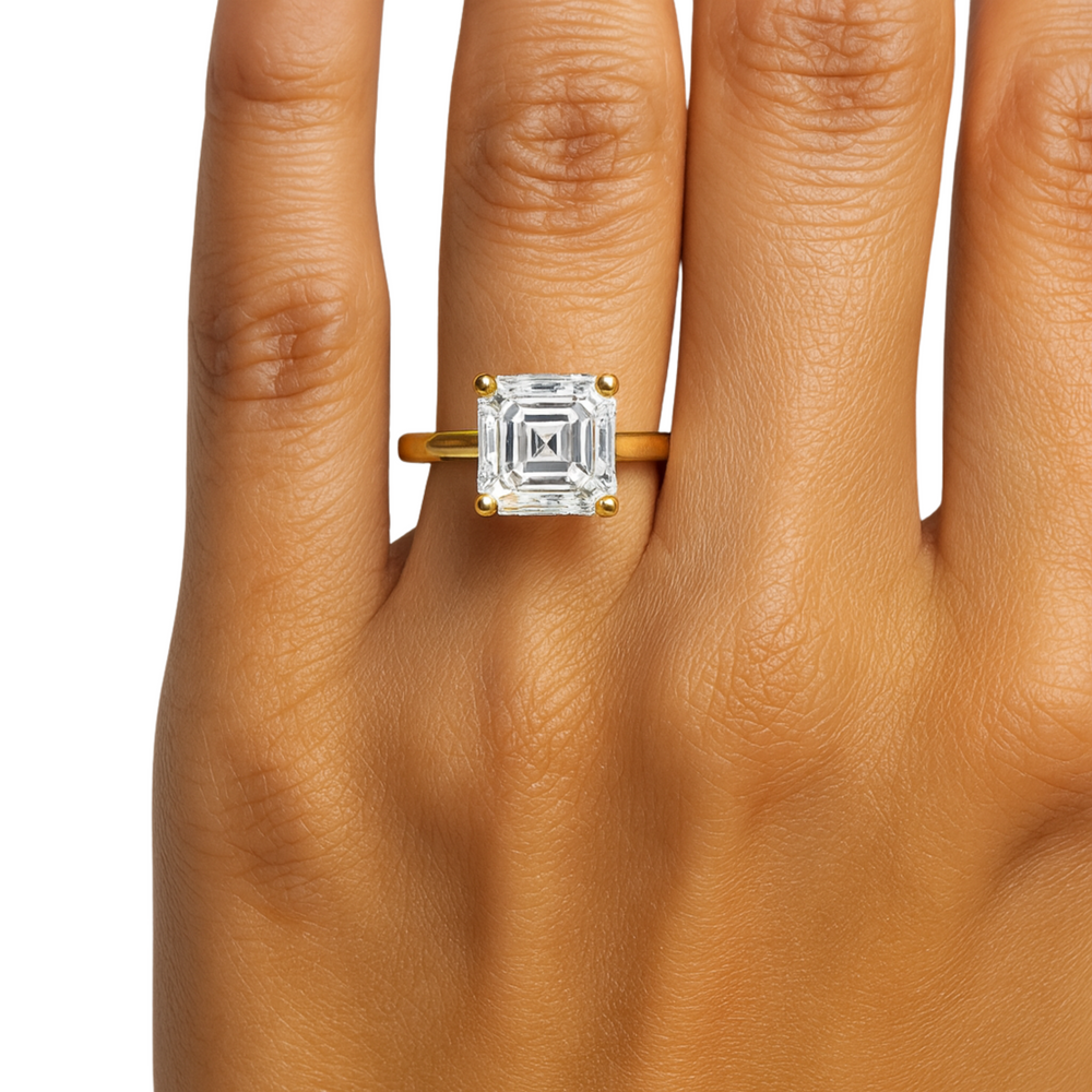 A close up view of a 3 ct asscher cut diamond engagement ring on the hand, 8mm asscher cut lab grown diamond engagement ring, traditional four prong solitaire design | Rare Earth Jewelry