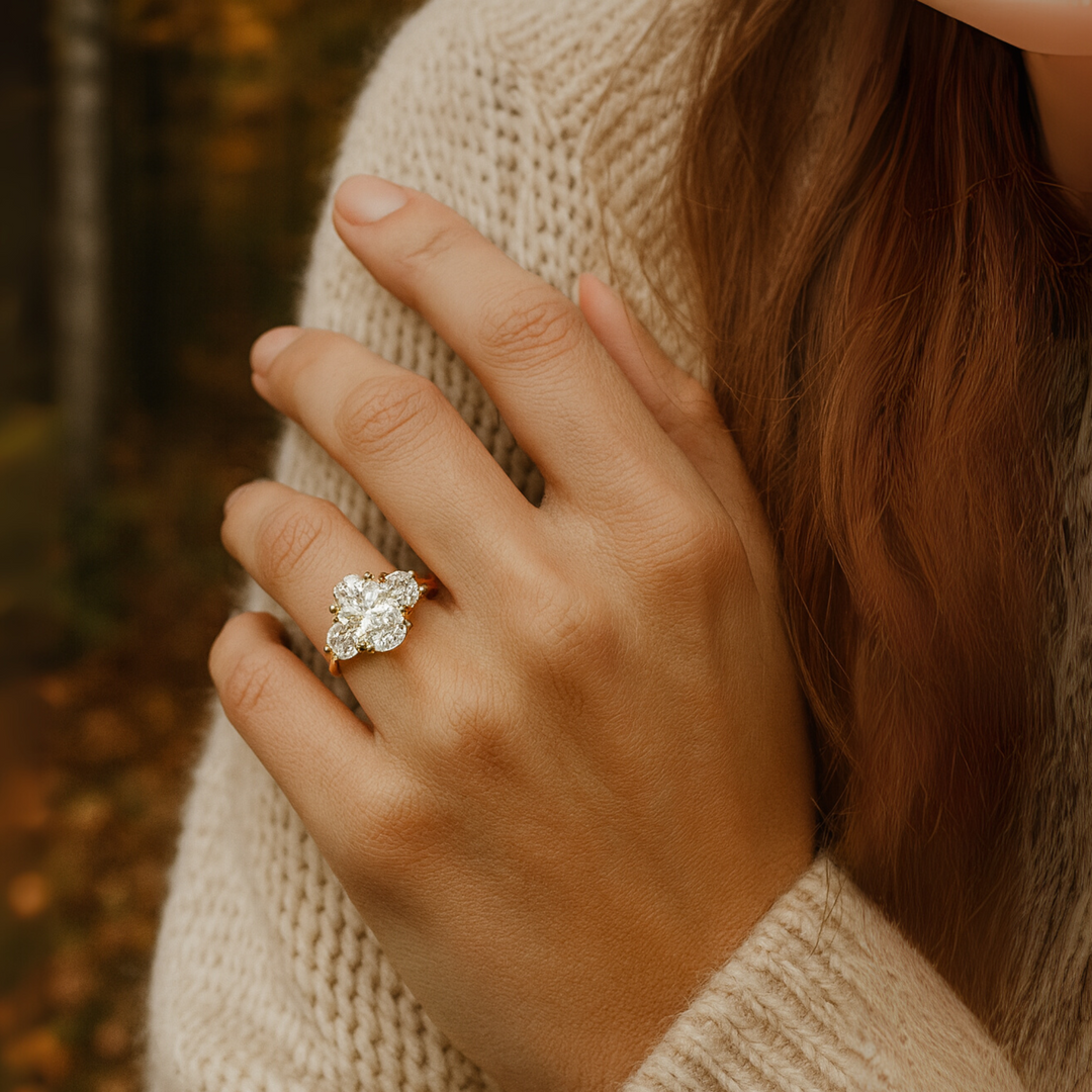 3 Stone Oval Engagement Ring shown on the Finger, 3 Carat Elongated Oval Lab Grown Diamond, approx. 12x8mm on a Size 7 Finger,  Three Stone Setting with Half Moon Side Stones, 5 Carats Total Weight | Rare Earth Jewelry