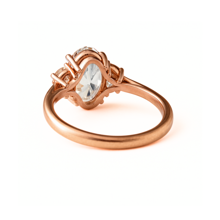 An oval three stone engagement ring setting viewed from underneath the gallery.  3 carat oval lab grown diamond engagement ring in rose gold | Rare Earth Jewelry