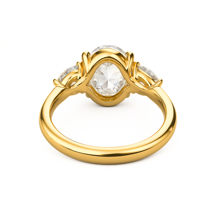 A view of the underside and gallery of the 3 carat oval lab grown diamond engagement ring with half moon side stones in a 3 stone setting | Rare Earth Jewelry