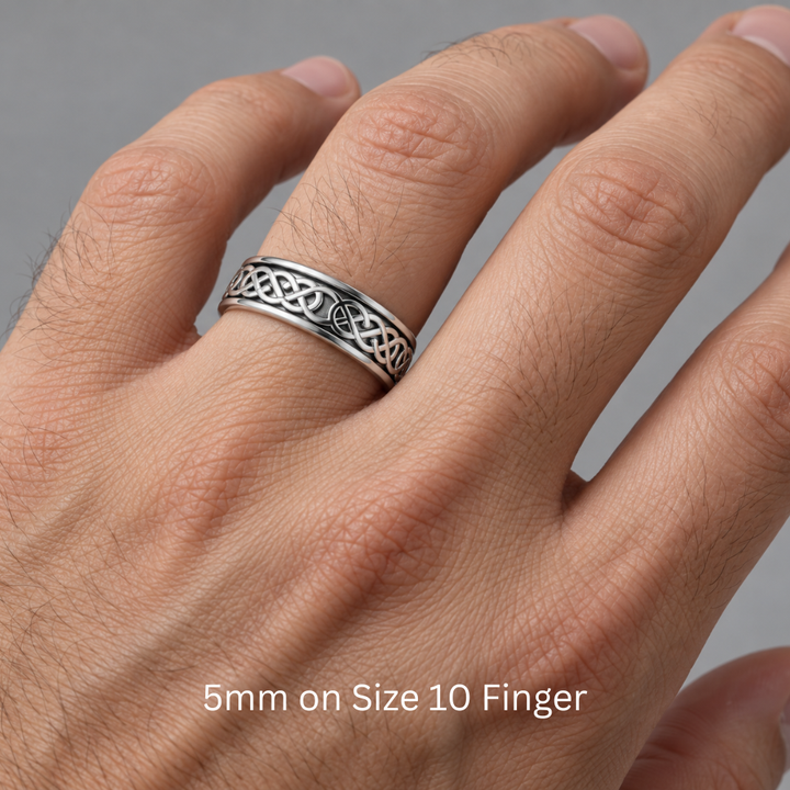 5mm wedding band with an irish celtic knot design shown on a man's hand.