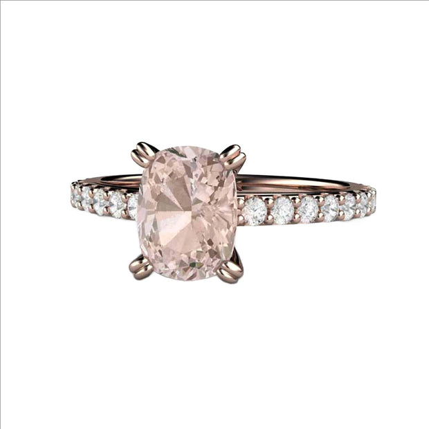 A Morganite solitaire engagement ring with an 8x6mm rectangular cushion cut Morganite and Diamond accents in rose gold by Rare Earth Jewelry.