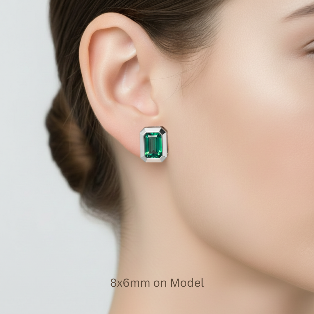 8x6mm emerald cut lab grown emerald earrings shown on ear model, modern minimalist style | Rare Earth Jewelry