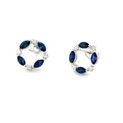 Blue Sapphire stud earrings with diamonds in a round circle design in white gold.