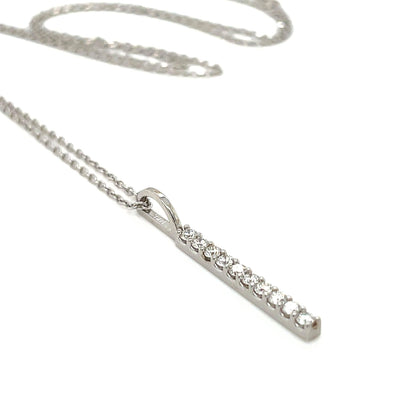A modern bar style vertical line pendant with ten round diamonds.  Lab grown or natural diamond necklace in 14K White Gold.