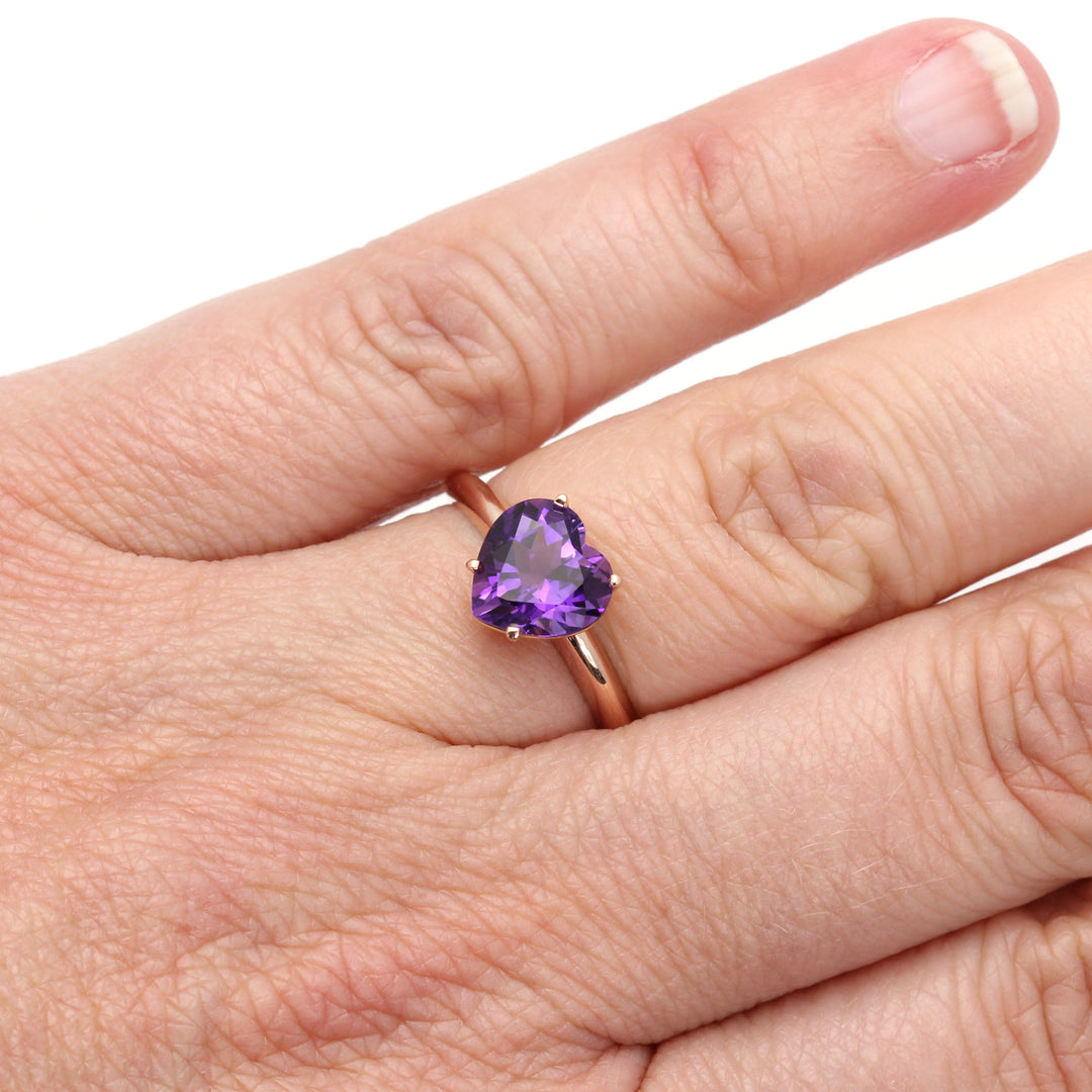 Amethyst Heart Shaped Ring in 14K Rose Gold shown on the Hand. February Birthstone Ring