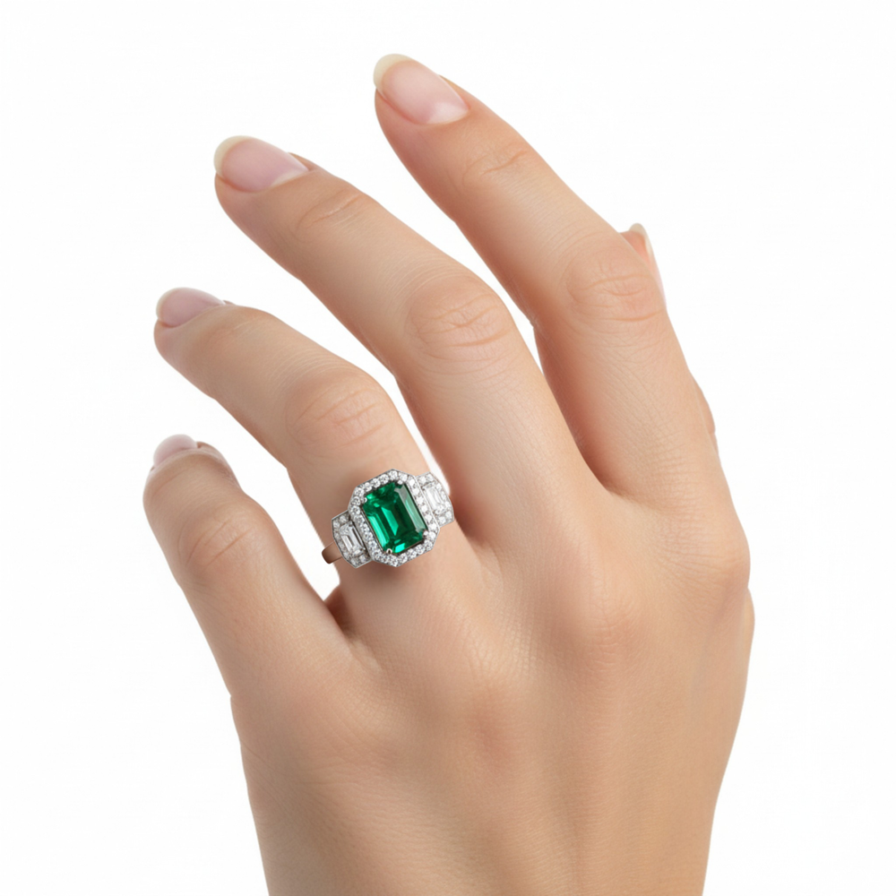 Large Emerald Engagement Ring 3 Stone design with Lab Created Diamond Halo shown on the Hand in 14K White Gold |  Rare Earth Jewelry