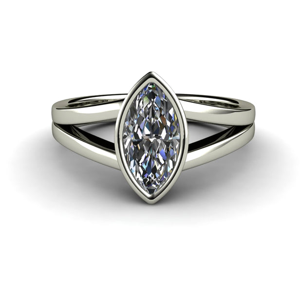 Moissanite marquise solitaire ring in white gold with a bezel setting and split band.