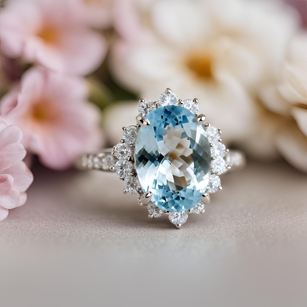 A oval aquamarine engagement ring in a vintage inspired diamond halo design from Rare Earth Jewelry.