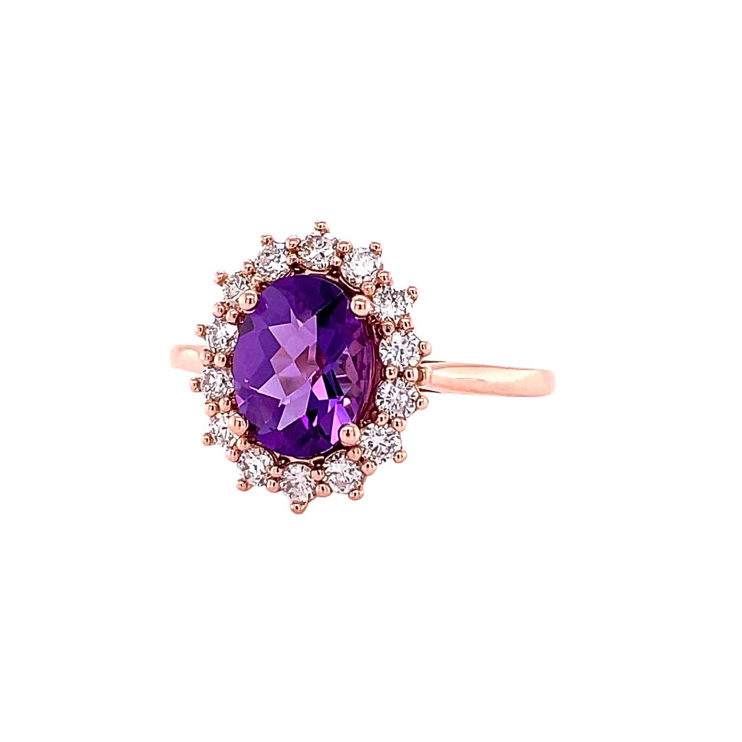 A vintage inspired Amethyst and Diamond ring with a feminine cluster design and diamond accents.  An oval cut  natural Amethyst gemstone ring from Rare Earth Jewelry.