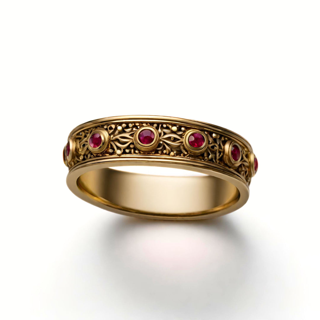 An antique style ruby wedding ring with bezel set rubies and a granulated etruscan design from Rare Earth Jewelry.