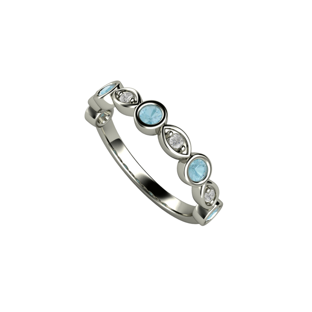 A natural aquamarine band with diamonds with a unique scalloped design.  March birthstone ring