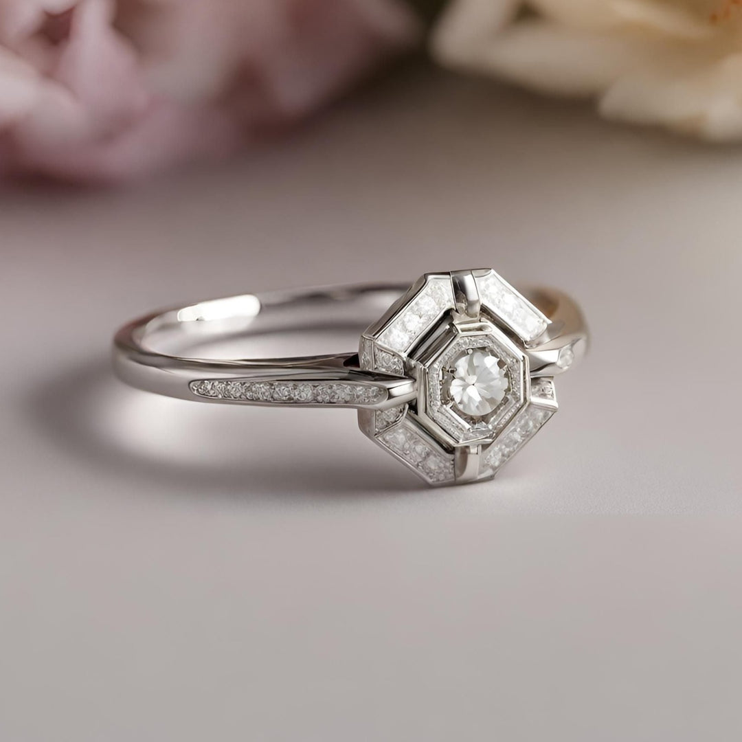 An art deco inspired small diamond engagement ring in an antique style hexagon shaped geometric design from Rare Earth Jewelry..