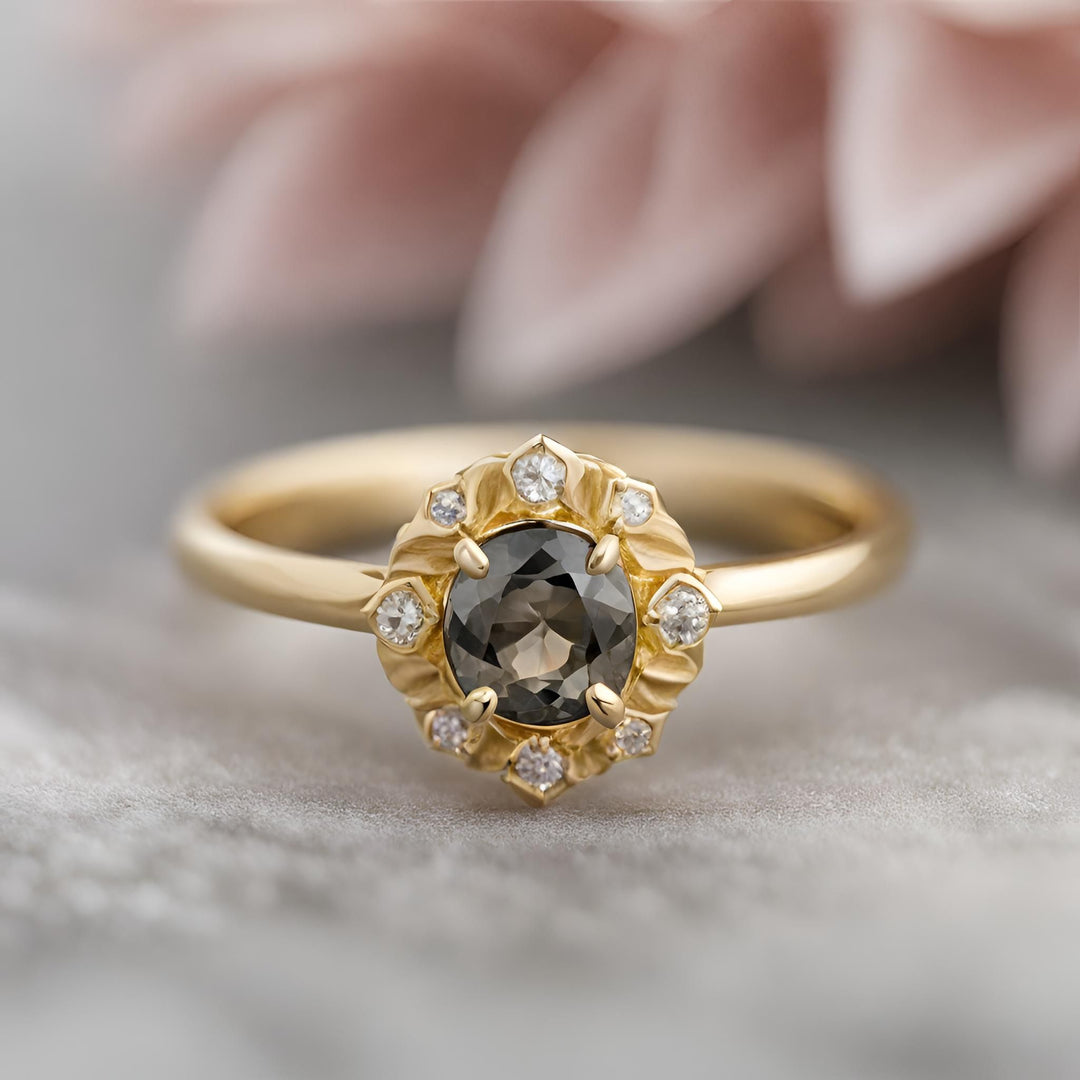 A baroque style engagement ring with a natural gray spinel and diamonds in 18K gold from Rare Earth Jewelry.