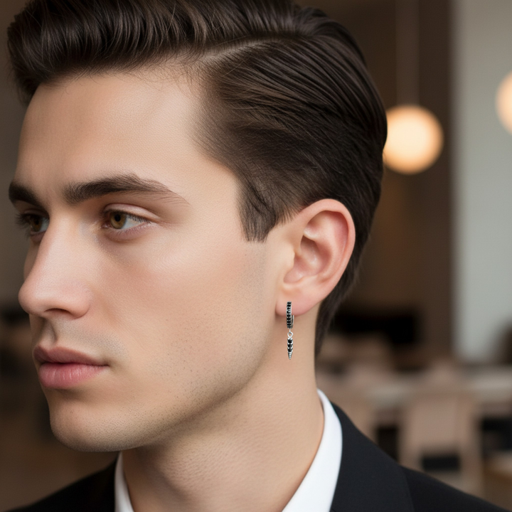 Male model wearing black diamond hoop earring, 14K gold huggie with arrow dangle drop, modern unisex design, natural black diamonds, 20mm slim spike earring | Rare Earth Jewelry