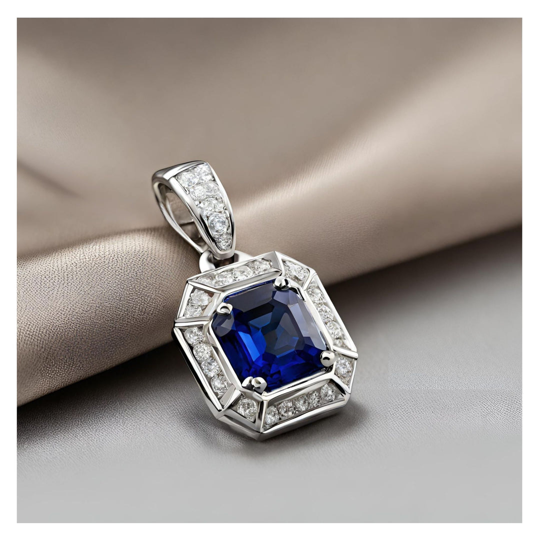 A blue sapphire asscher cut pendant with diamonds in an Art Deco style from Rare Earth Jewelry.