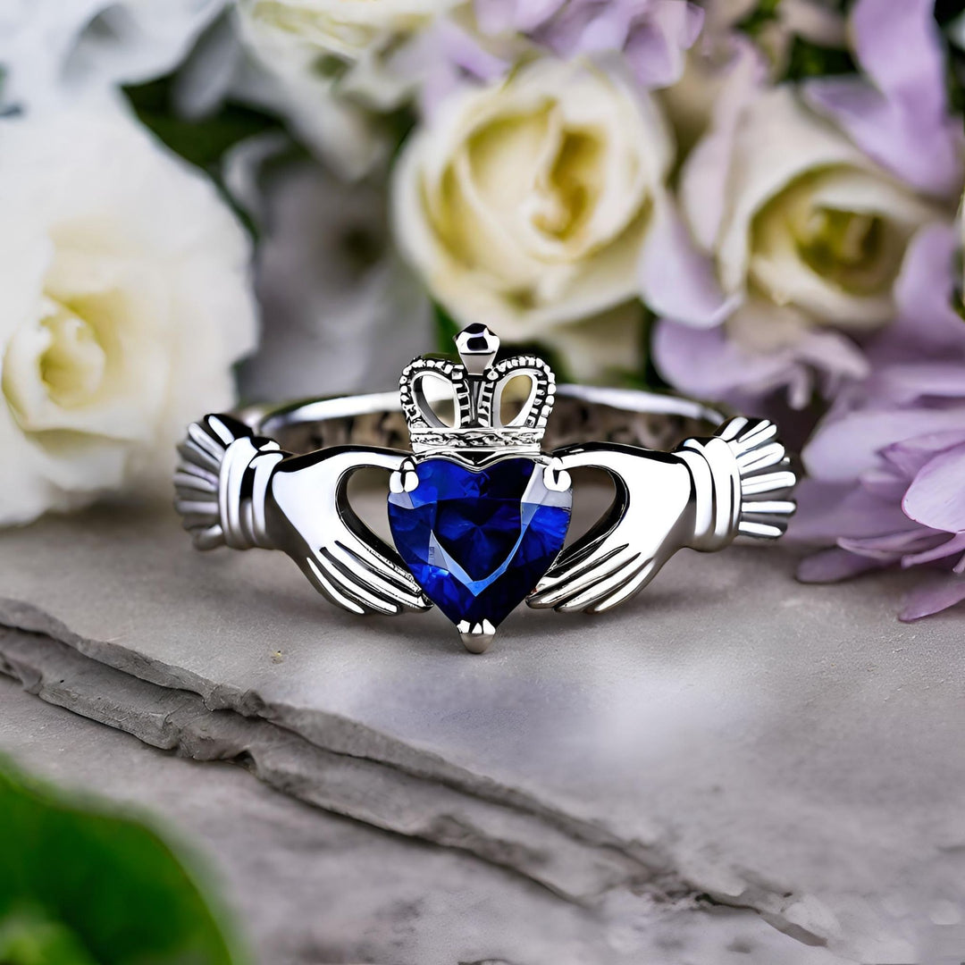 A blue sapphire claddagh ring, an Irish engagement ring or promise ring, gold and platinum Ireland jewelry from Rare Earth Jewelry.