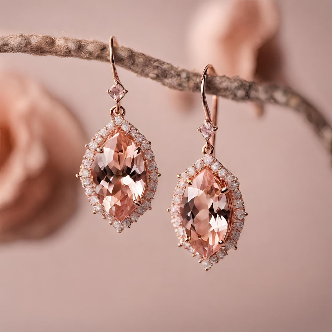 A pair of 14K Rose Gold earrings perfect for a bride with marquise cut natural Morganite and diamonds from Rare Earth Jewelry.