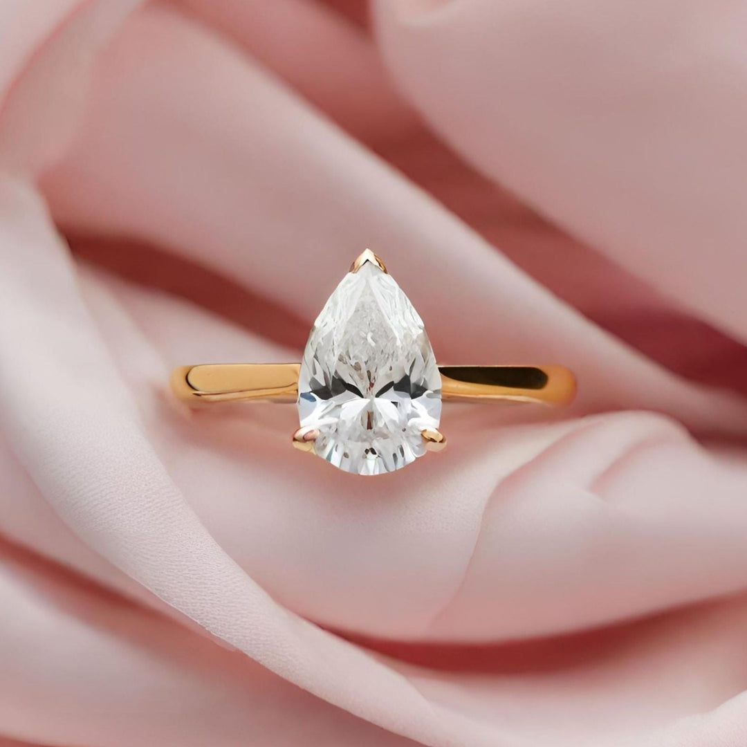 A classic pear cut lab created diamond solitaire engagement ring from Rare Earth Jewelry.