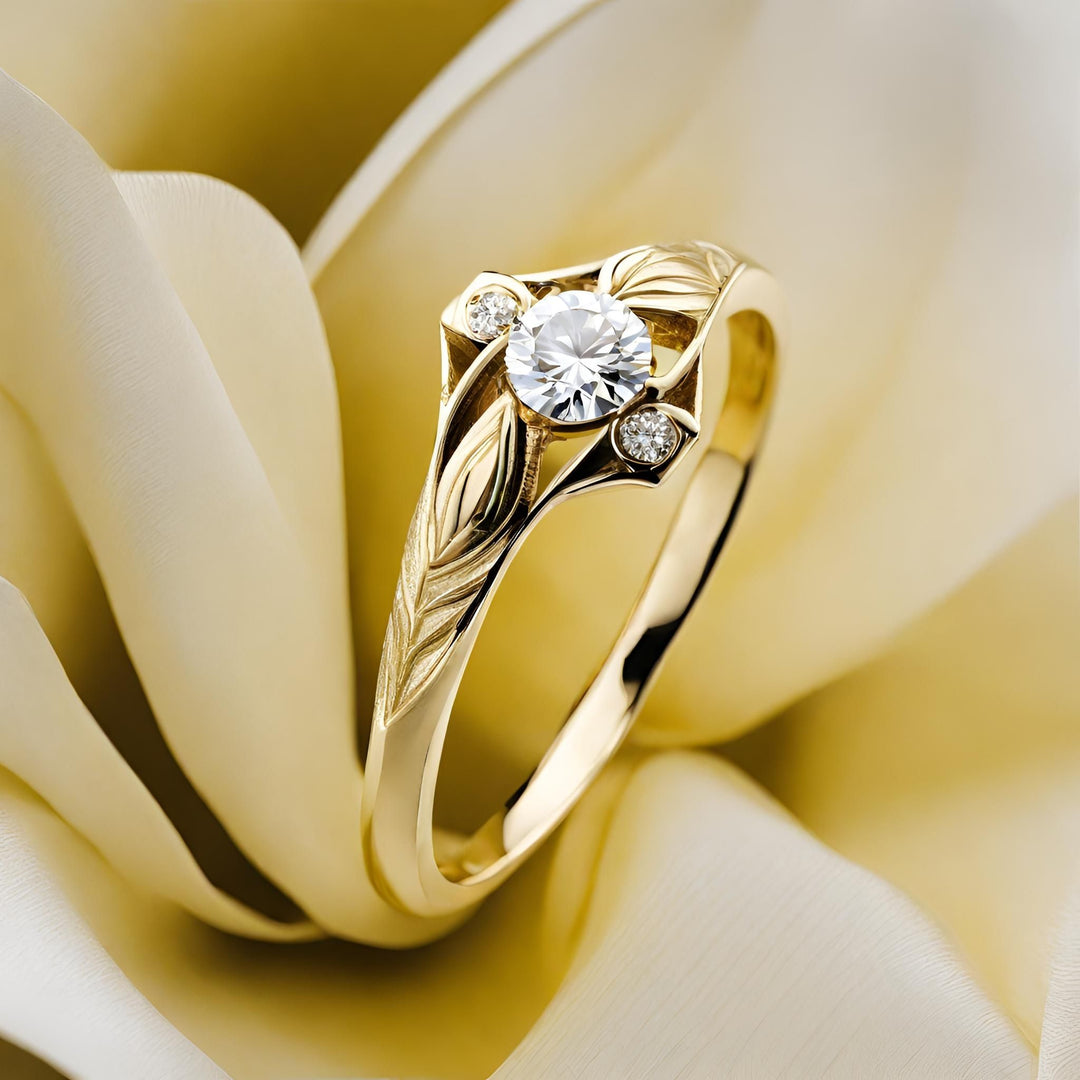 A contemporary three stone diamond ring with a modern art deco design in yellow gold from Rare Earth Jewelry..