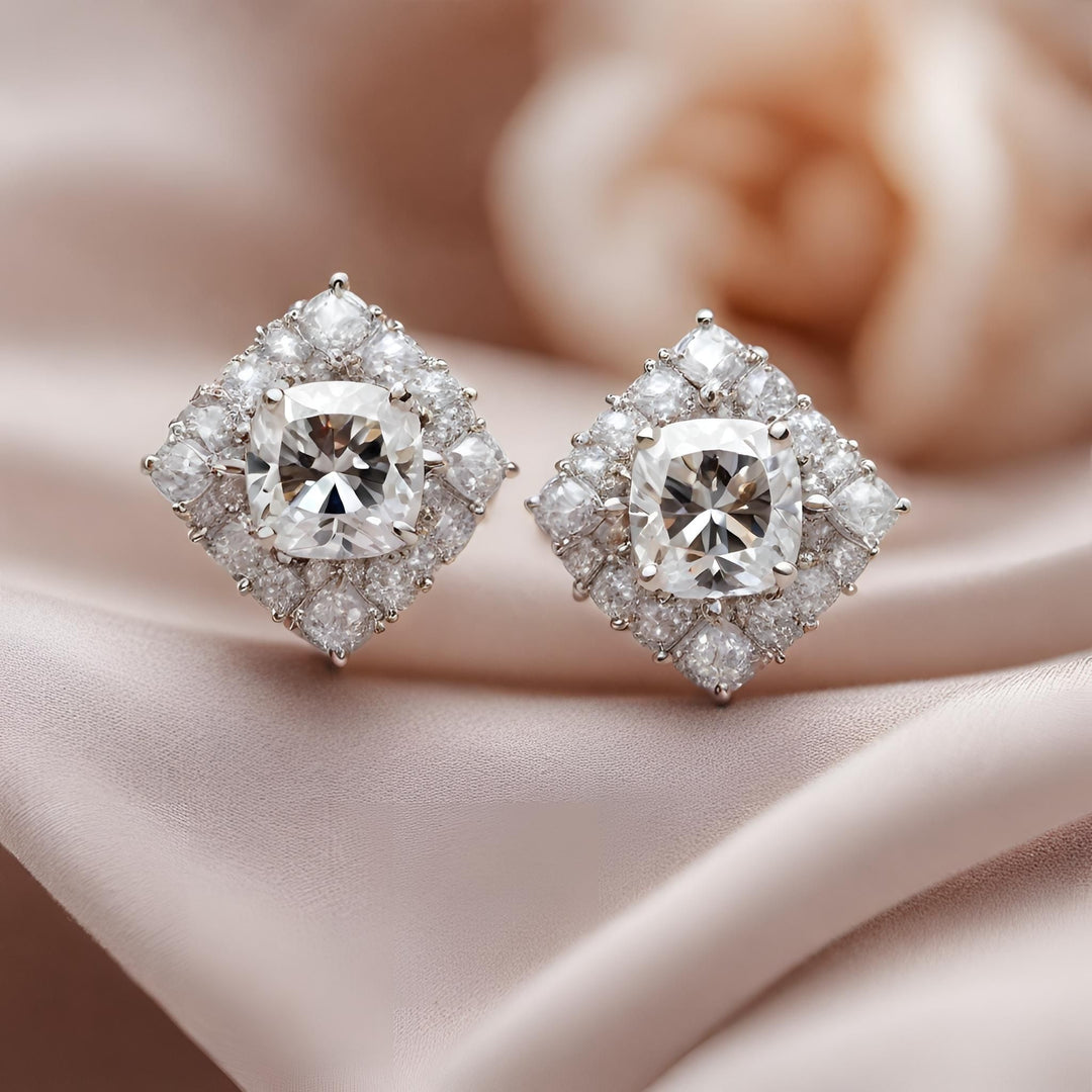 Cushion cut diamond earrings in a vintage style halo design, diamond halo studs in gold or platinum from Rare Earth Jewelry.