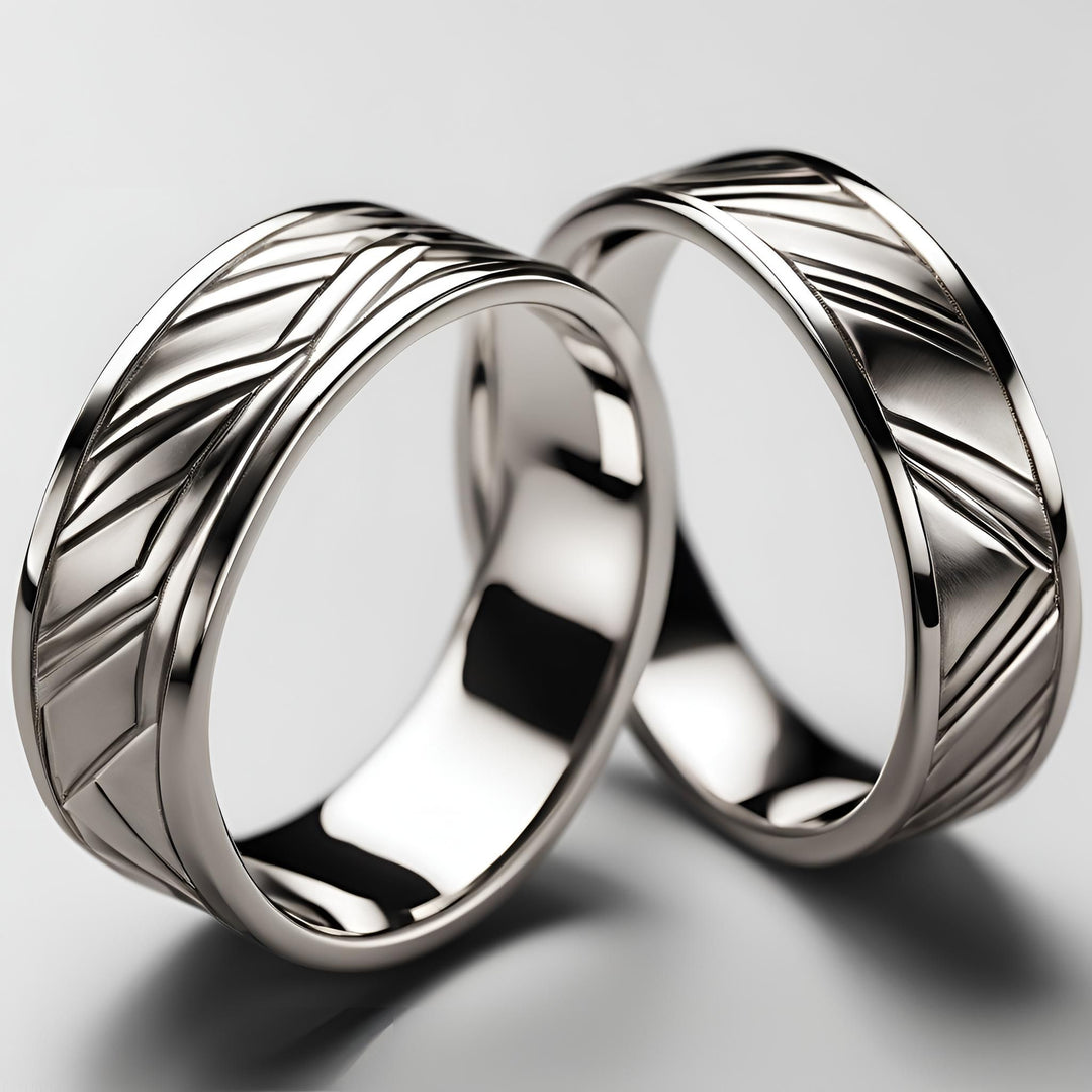 A pair of custom wedding bands with an abstract modern linear design in gold or platinum from Rare Earth Jewelry.