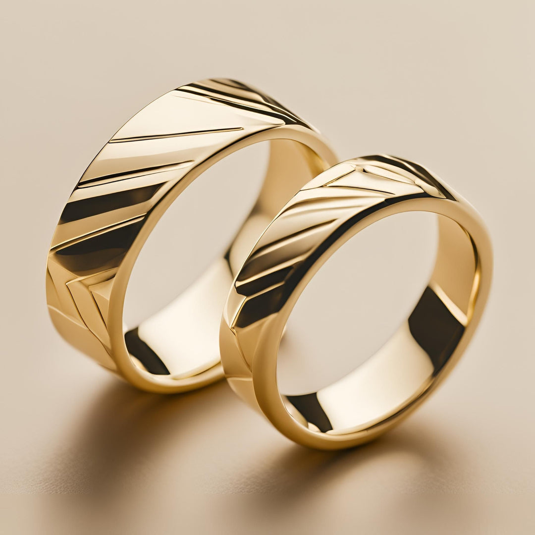 A pair of mens and womens custom wedding bands with an abstract geometric design in 14K or 18K Gold from Rare Earth Jewelry.