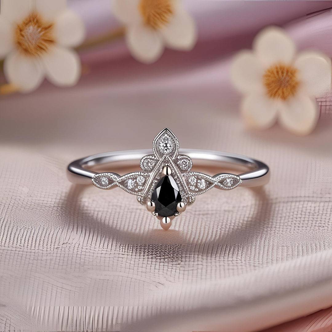 Dainty black diamond tiara ring with romantic vintage design, pear cut center, delicate milgrain detailing, and Edwardian inspired craftsmanship. Antique & Gothic Style Engagement Rings | Rare Earth Jewelry