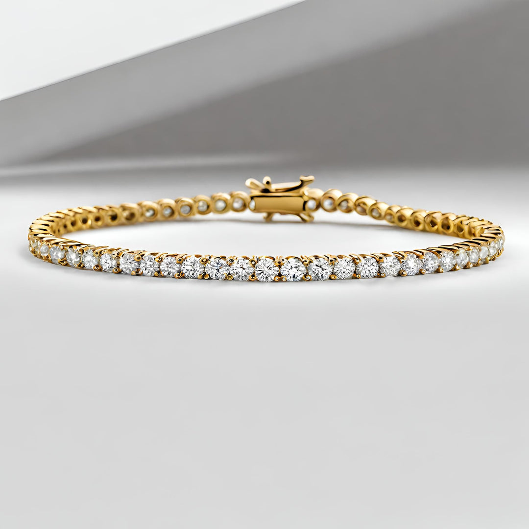 A 14K yellow gold diamond tennis bracelet prong set style from Rare Earth Jewelry.