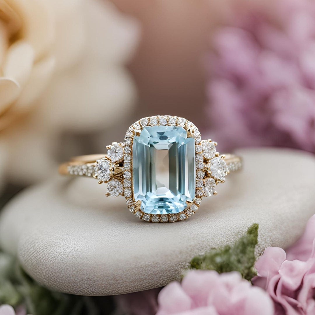 A romantic style aquamarine engagement ring with an elongated cushion cut natural aquamarine and pave set diamonds from Rare Earth Jewelry.