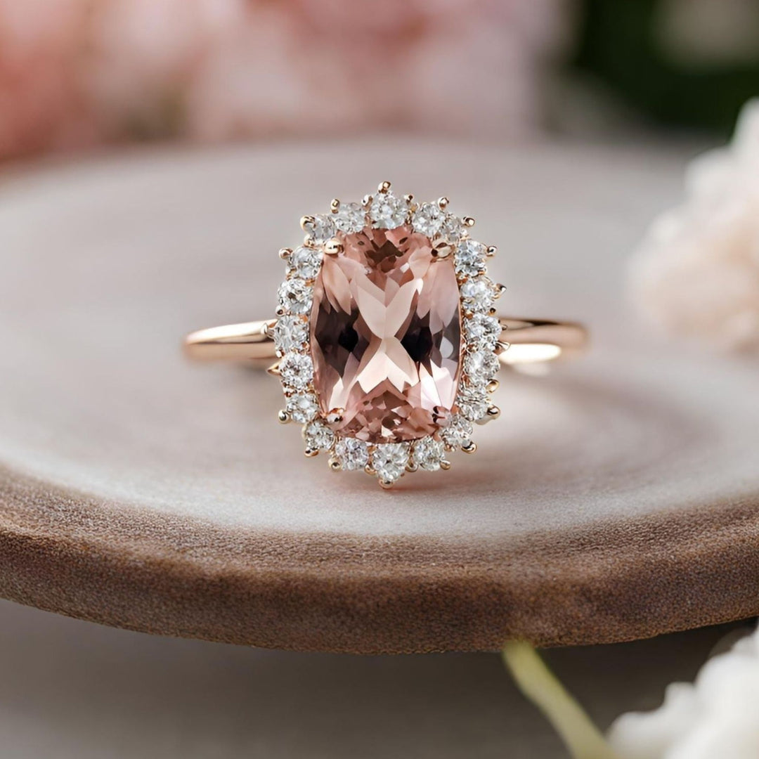 A romantic pink morganite engagement ring with an elongated cushion cut morganite and diamonds from Rare Earth Jewelry.