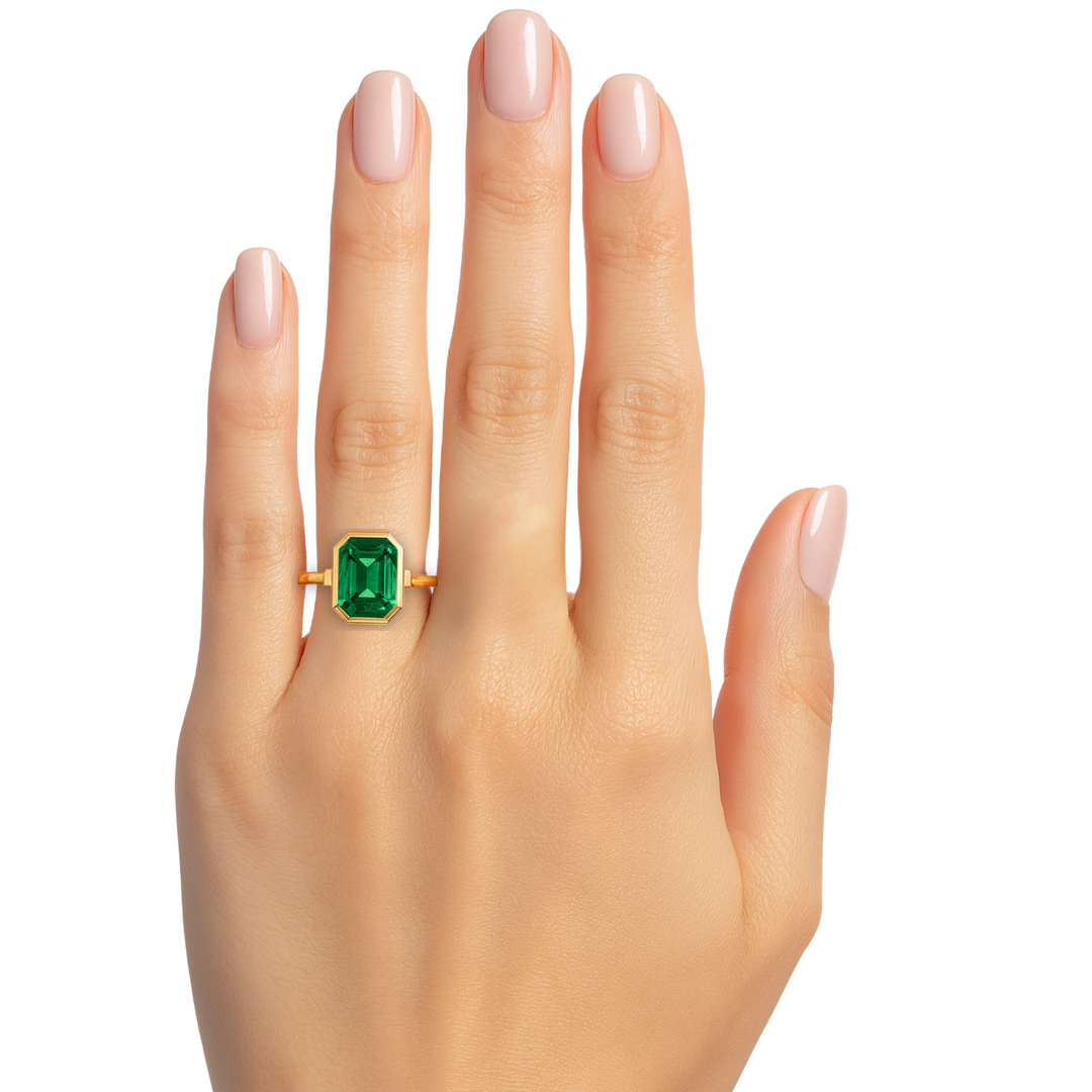 Emerald Cut Emerald Ring on the Finger, 2 Carat Solitaire Engagement Ring with Modern Minimalist Bezel Set Design, May Birthstone Ring  in Gold or Platinum | Rare Earth Jewelry