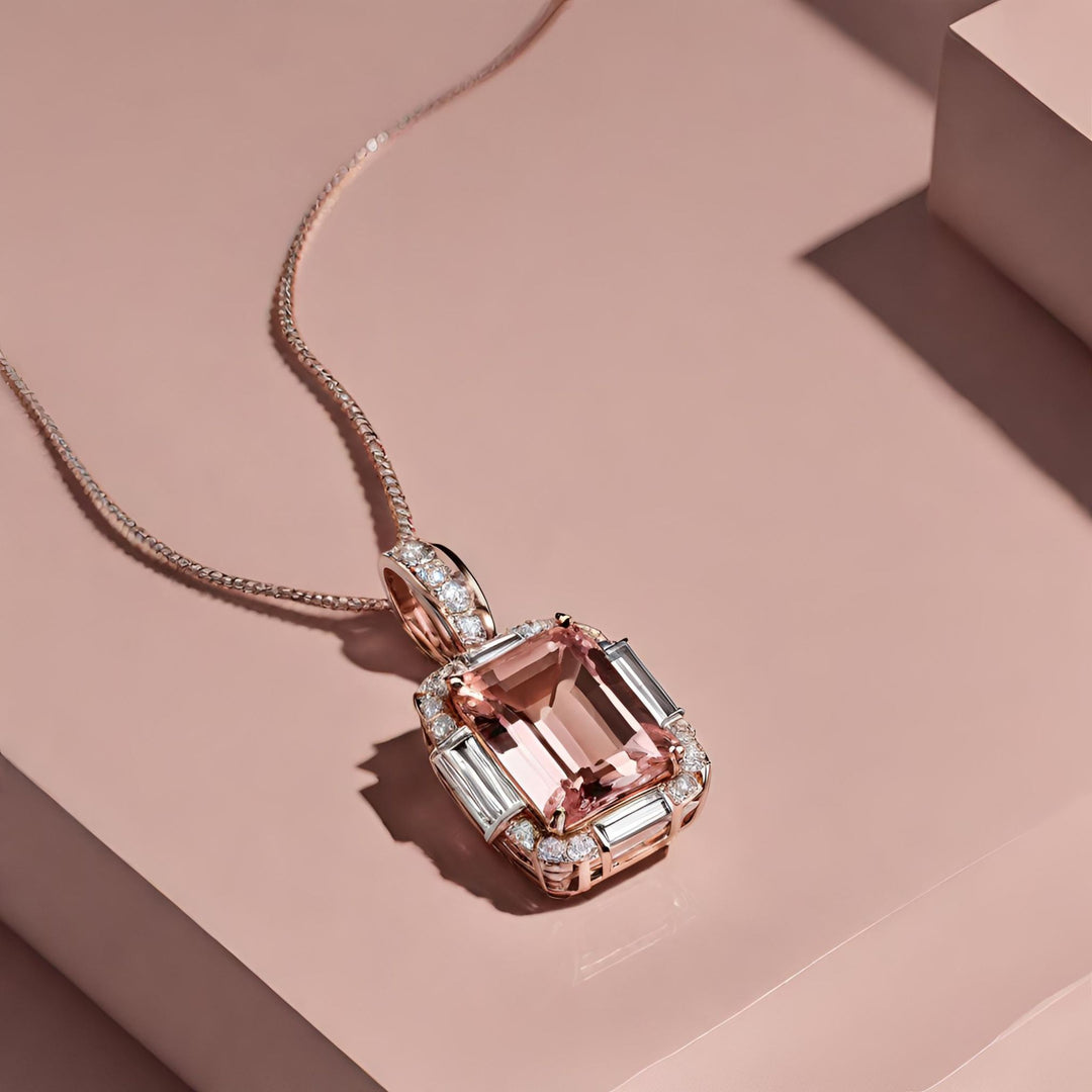 An emerald cut natural Morganite pendant with diamond rounds and baguettes in 14K Rose Gold, sophisticated beauty from Rare Earth Jewelry.