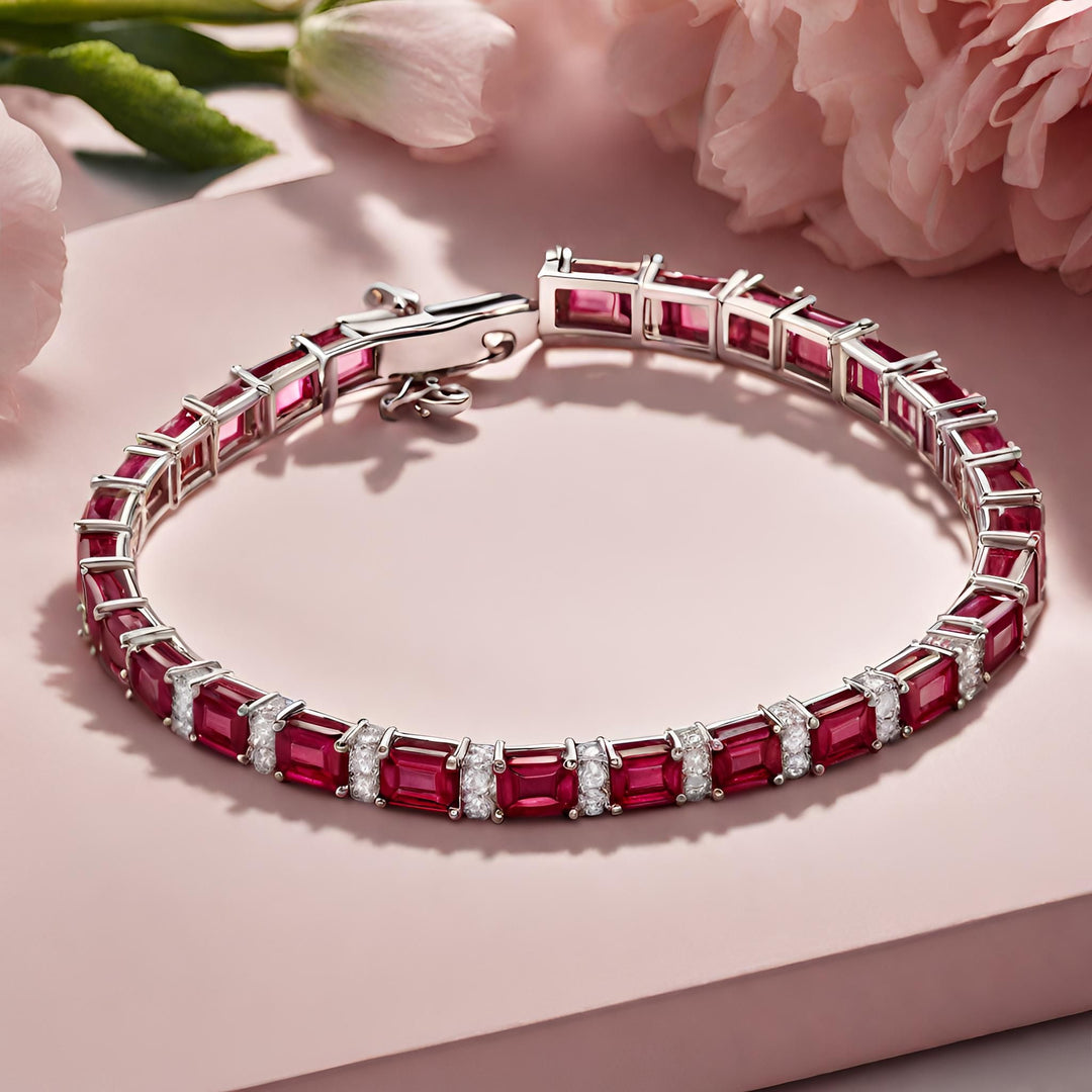 A classic ruby and diamond tennis bracelet with emerald cut rubies and round diamonds in 14K Gold from Rare Earth Jewelry.