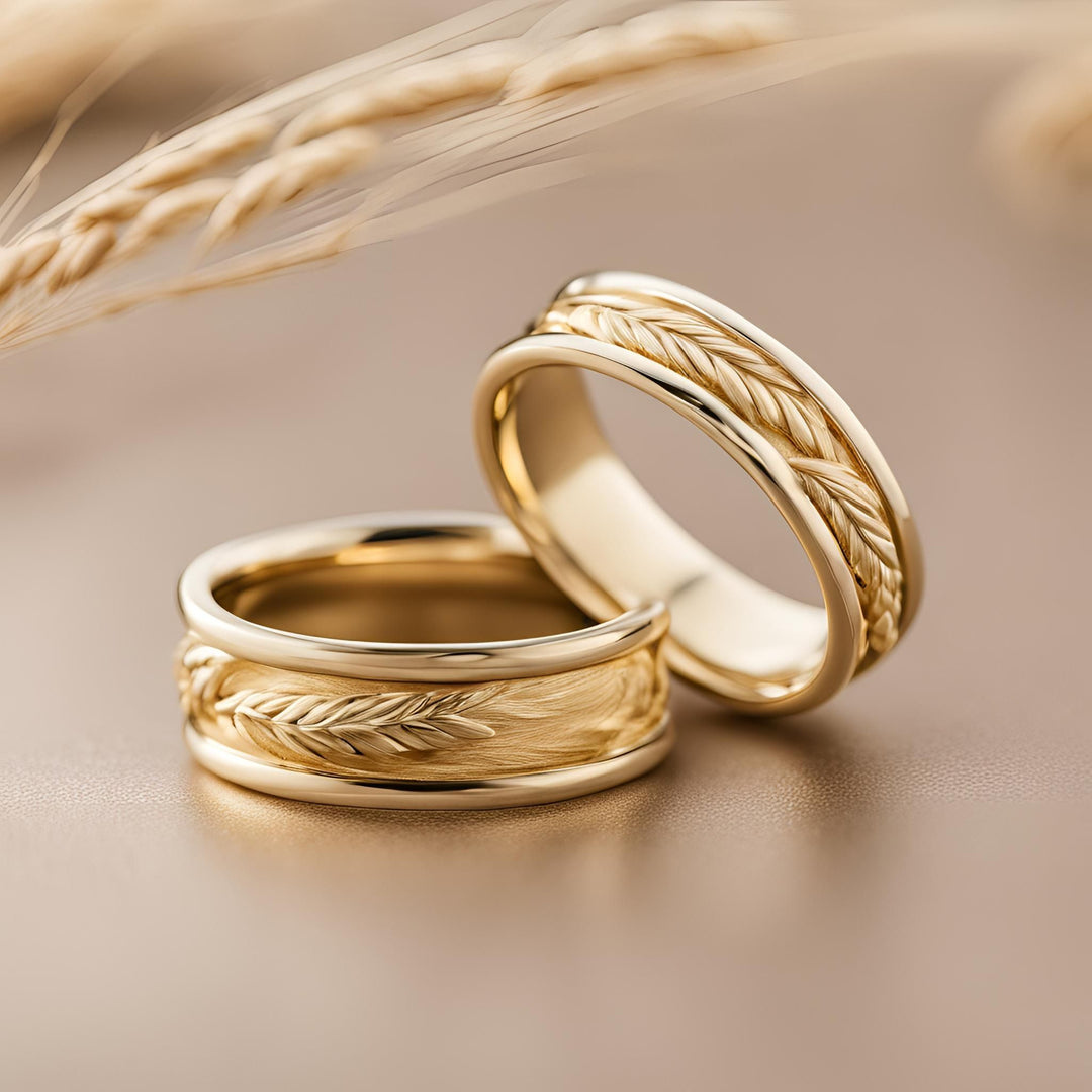 A pair of gold wedding rings with a wheat design for men or women in 14K or 18K from Rare Earth Jewelry.