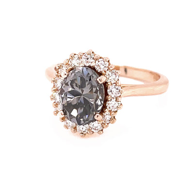 Gray Moissanite ring in Rose Gold. Oval grey Moissanite engagement ring in a cluster style halo setting.