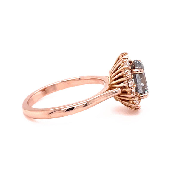 Gray Moissanite engagement ring oval halo in rose gold side view.
