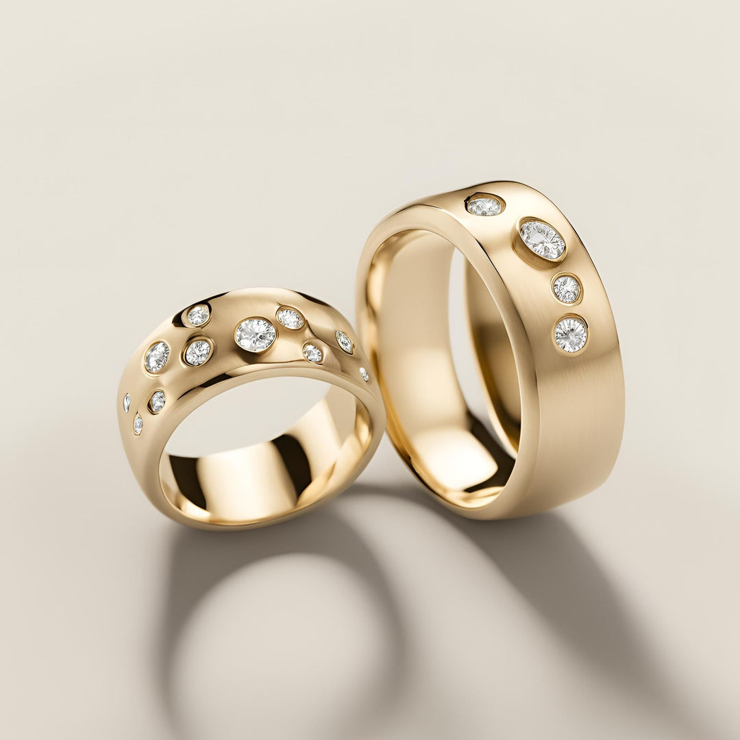 A pair of custom made modern wedding rings with gypsy set diamonds in 14K or 18K Gold from Rare Earth Jewelry.