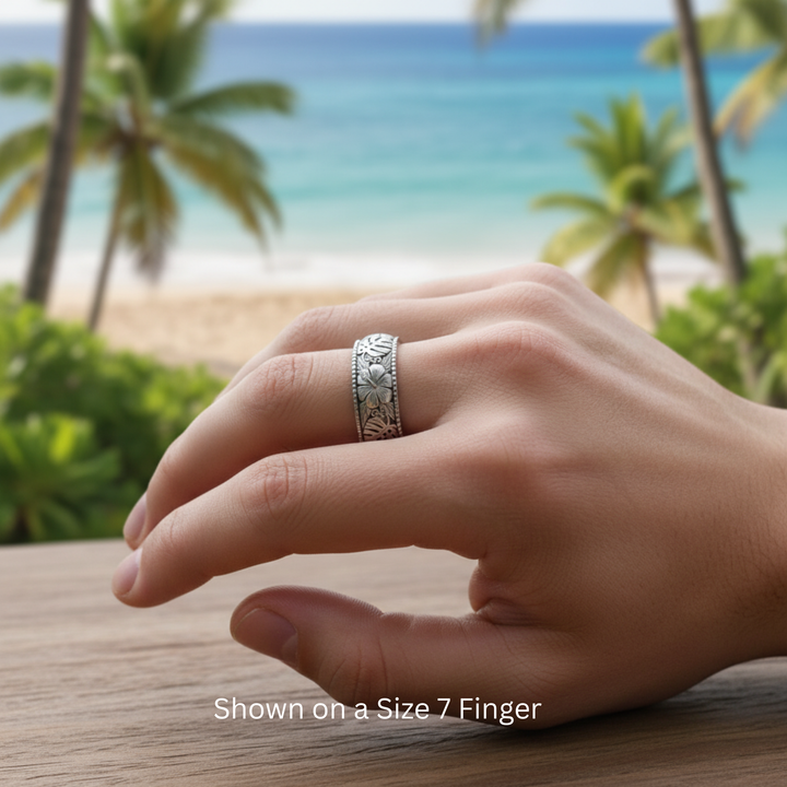 White gold Hawaiian hibiscus and monstera engraved ring worn on hand, tropical flower unisex wedding band for men and women | Rare Earth Jewelry