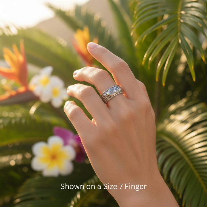 Hawaiian Flower Wedding Ring with Hibiscus and Monstera Leaf Design shown in 14K White Gold on a Size 7 Finger, Tropical Floral Engraved Wedding Ring | Rare Earth Jewelry