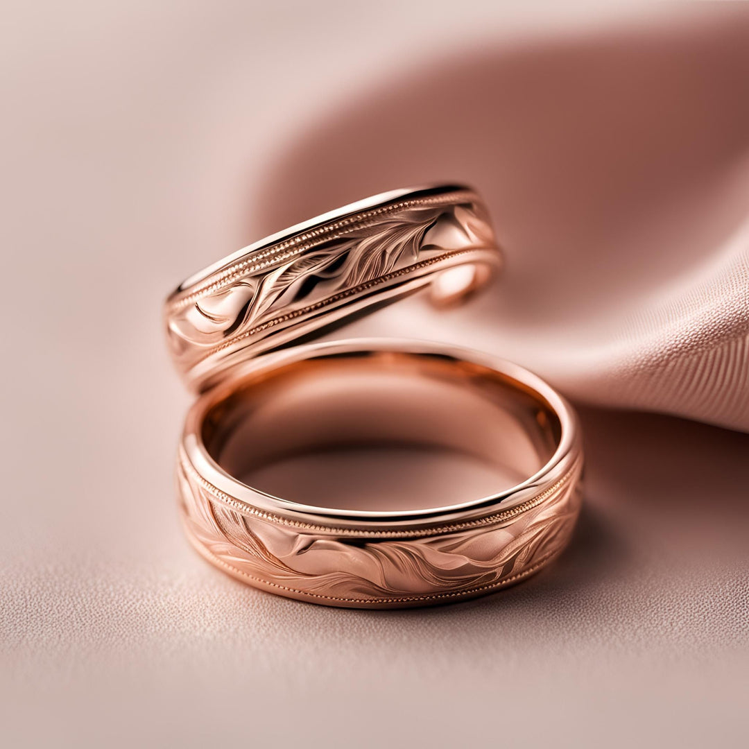 His and hers rose gold wedding rings with a vintage style engraved design from Rare Earth Jewelry.