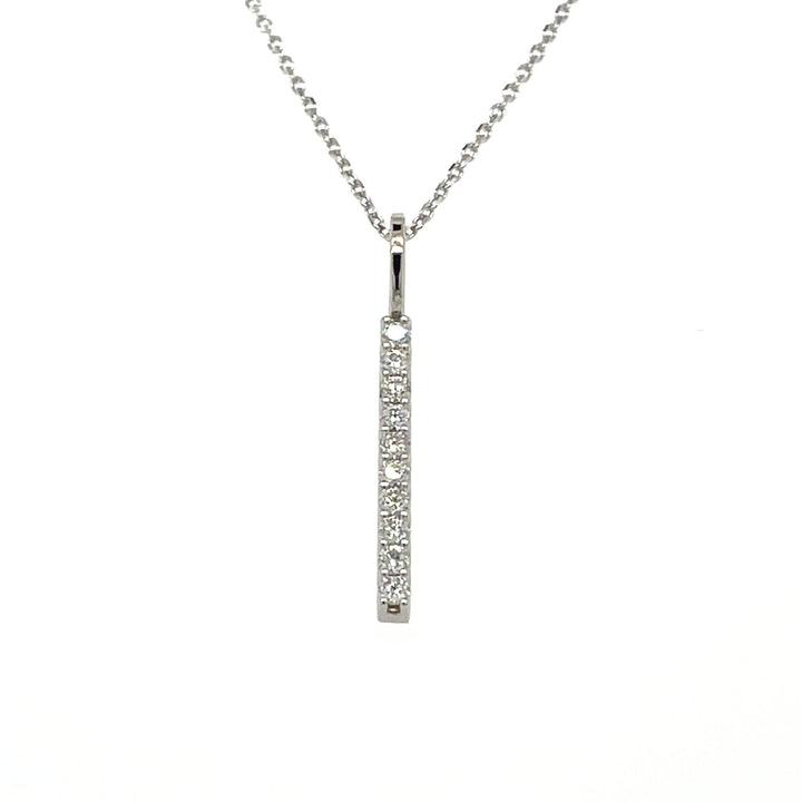 Lab grown diamond bar pendant with a minimalist vertical line style. Lab grown diamond necklace in white gold.