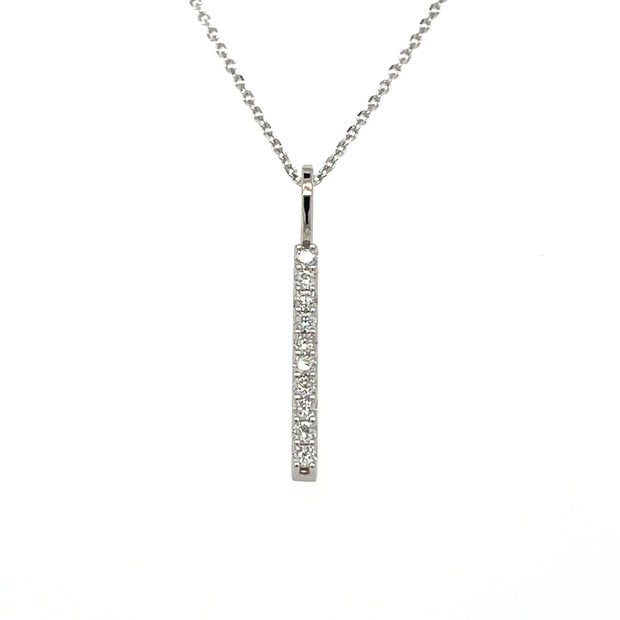 Lab grown diamond bar pendant with a minimalist vertical line style. Lab grown diamond necklace in white gold.