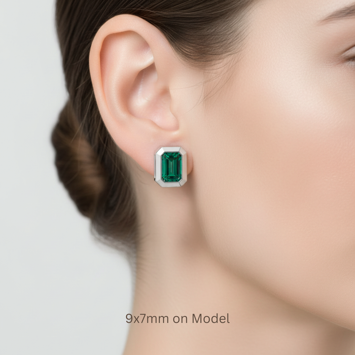 9x7mm emerald cut lab grown emerald earrings shown on ear model for size reference | Rare Earth Jewelry