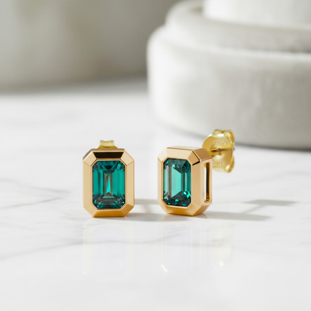 Emerald cut lab grown emerald earrings in 14K yellow gold bezel settings | Rare Earth Jewelry